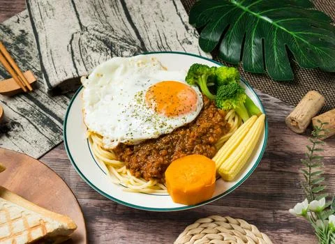 Spaghetti dish, Dry Curry Beef Pasta topped with rich meat sauce and a perf.. Stock Photos