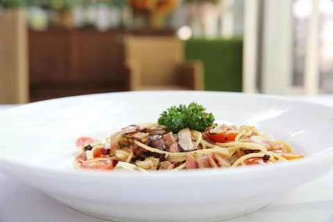 Spaghetti with dried chilli and bacon Stock Photos