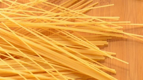 Spaghetti falling on desk. Stock Footage 73619859