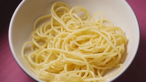 Spaghetti falling down to bowl Stock Footage 141580718