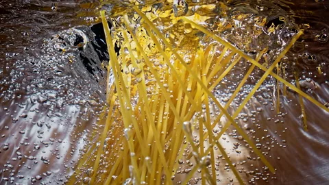 Spaghetti Falling Down in to the pot Slow motion 1000fps Stock Footage 130898354
