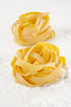 Spaghetti on flour background Foto stock