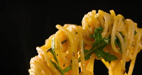 Spaghetti on Fork Closeup on Black background 4K Stock Footage 104061124