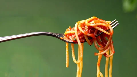 Spaghetti on fork isolated on green background. Stock Footage 301710061