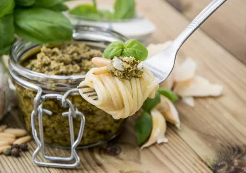 Spaghetti on fork with pesto Stock Photos