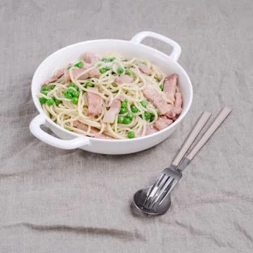 Spaghetti with fried bacon Stock Photos