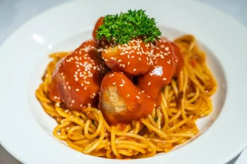 Spaghetti fried chicken cubes with tomato sauce Stock Photos