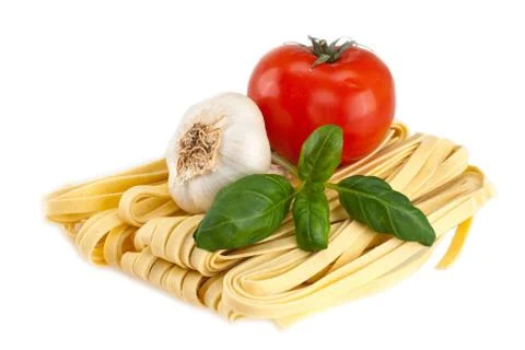 Spaghetti, garlic, tomatoes, basil Stock Photos