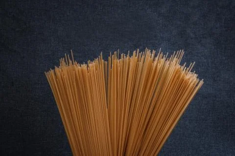 Spaghetti on gray background Stock Photos