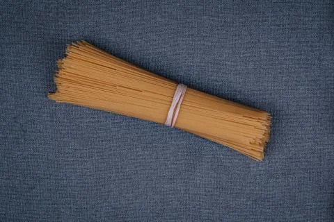 Spaghetti on gray background Stock Photos