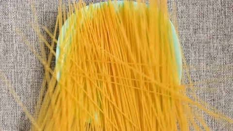 The spaghetti has fallen on a turquoise plate Stock Footage 137350071