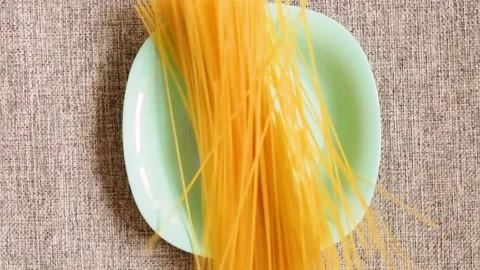 The spaghetti has fallen on a turquoise plate Stock Footage 137350112