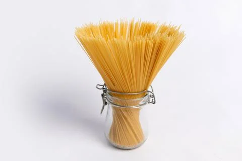Spaghetti in a jar on a white background, space for text 写真素材