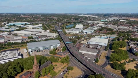 Spaghetti junction Birmingham aerial reversing shot pulling away over M6 Stock Footage 344092946