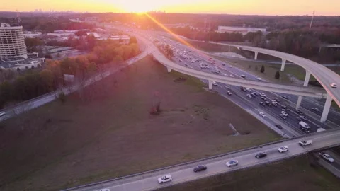 Spaghetti Junction with Sunset and Atlanta Cityscape - Static Drone Footage Stock Footage 295442228
