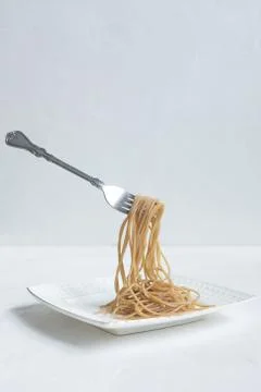 Spaghetti made from buckwheat on a white table Stock Photos