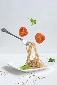 Spaghetti made from buckwheat on a white table Stock Photos
