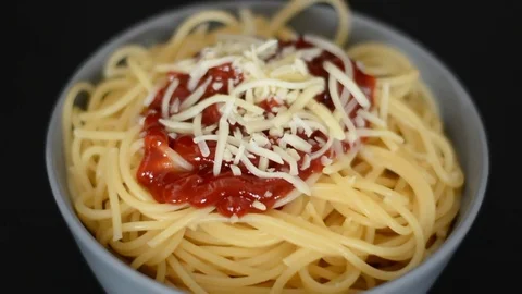 Spaghetti meal comes into focus. Close up. Stock Footage 74491696