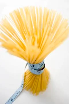Spaghetti with measuring tape Stock Photos