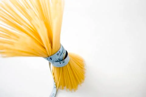 Spaghetti with measuring tape Stock Photos