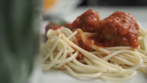 Spaghetti with meatballs on a plate Stock Footage 98786076
