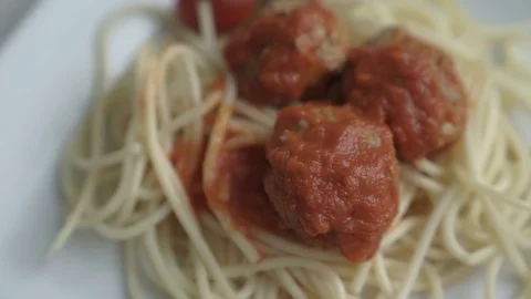 Spaghetti with meatballs on a plate Stock Footage 98786077