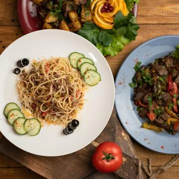 Spaghetti or pasta, Simple rustic food. Hearty lunch. Serving plate of Italian Stock Photos