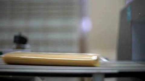 Spaghetti packages running on an automated machinery in a pasta factory. Stock Footage