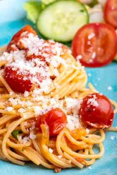 Spaghetti pasta with cherry tomatoes Stock Photos
