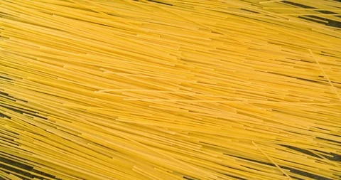 Spaghetti Pasta Falling on Table Top view Food Background 4K Stock Footage 104109606