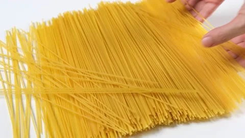 Spaghetti pasta falling on white backgro... | Stock Video | Pond5