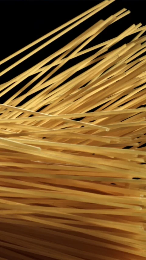 Spaghetti pasta flies up and falls down. Filmed on a high-speed camera at 1000 Stock Footage 335360789