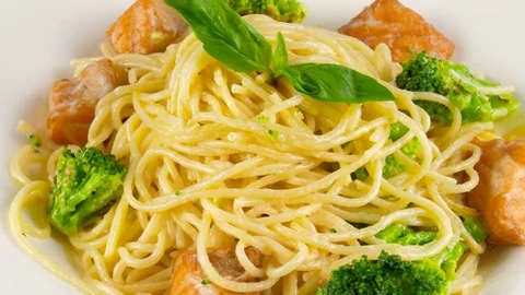 Spaghetti pasta with fried salmon and broccoli Stock Footage 78233426