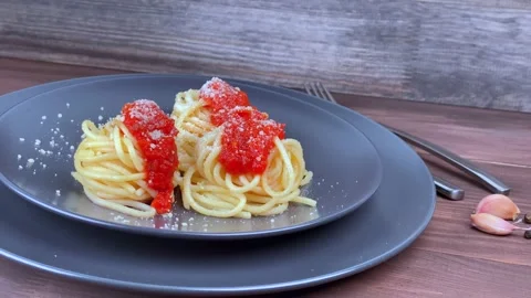 Spaghetti pasta on a gray plate with tomato sauce. Stock Footage 149756612