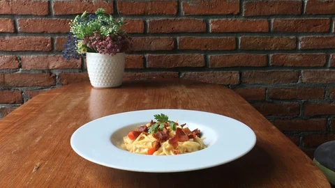 Spaghetti pasta with vegetables with a fork closeup Stock Footage 103586206