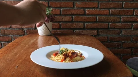 Spaghetti pasta with vegetables with a fork closeup Stock Footage 104549676