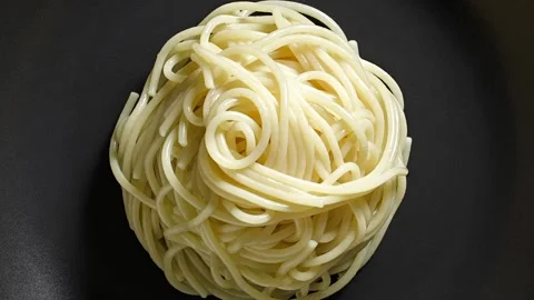Spaghetti pasta white cooked on grey plate 動画素材 228808921