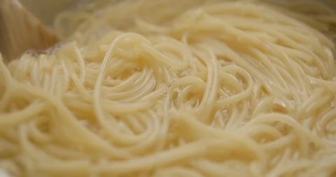Spaghetti pastas cooking slow motion 4K Stock Footage 103494698