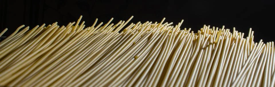 Spaghetti pattern close up on black background Stock Photos