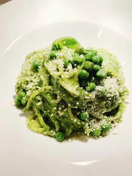 Spaghetti with peas Stock Photos