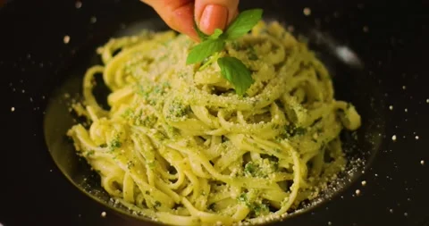 Spaghetti with pesto sauce Stock Footage 237434615