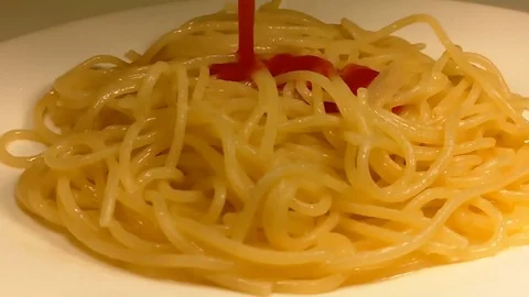 Spaghetti is poured with ketchup Video stock 82818666