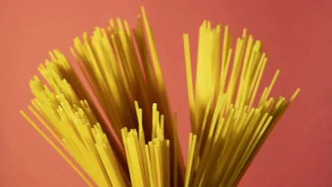 Spaghetti raw pasta isolated on pink background Stock Footage 145368092