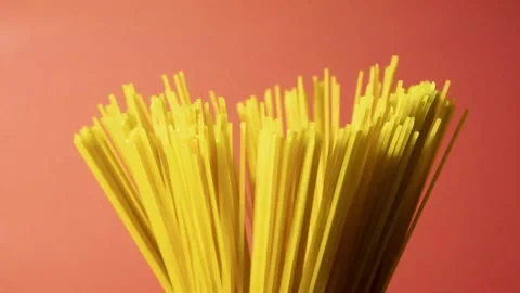 Spaghetti raw pasta isolated on pink background Stock Footage 146660387
