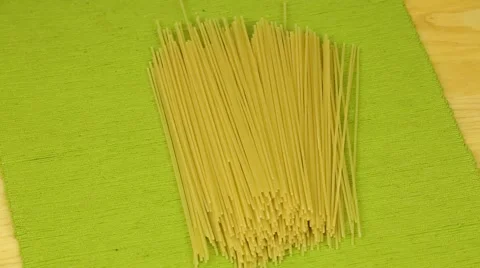 Spaghetti rotate on a green background Stock Footage 44697111