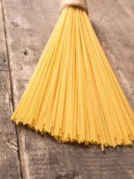 Spaghetti on a rustic wooden table Stock Photos