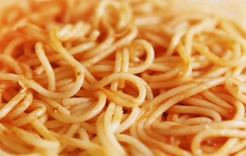 Spaghetti in sauce Stock Photos