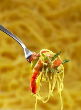 Spaghetti with scampo on a fork Stock Photos
