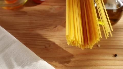 Spaghetti show over the table. Ingredients for pasta carbonara. High angle view. Stock Footage 244449574