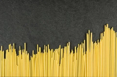 Spaghetti on a slate background Stock Photos